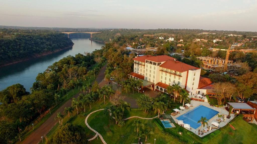 an aerial view of a building next to a river at Panoramic Grand - Iguazú in Puerto Iguazú