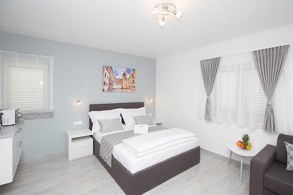 Posteľ alebo postele v izbe v ubytovaní Villa Apartments Art