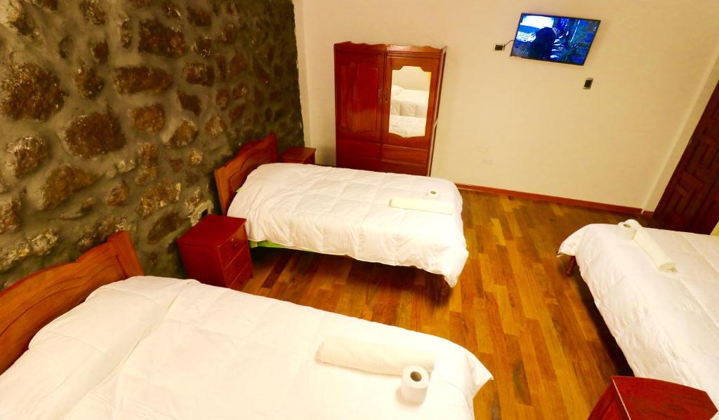 Postel nebo postele na pokoji v ubytování Hotel Choquequirao