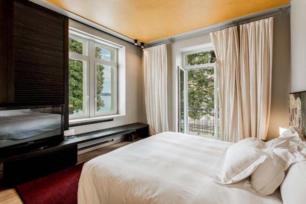 Postel nebo postele na pokoji v ubytování Hotel Bella Riva