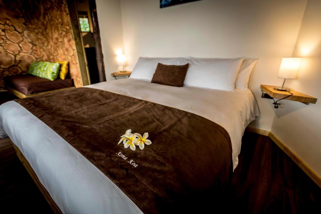 Voodi või voodid majutusasutuse Kona Koa Lodge toas