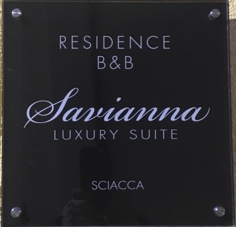 a sign for a restaurant with the words assurance bb zambiana luxury suite at Residenza Savianna in Sciacca