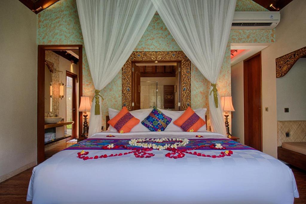 Postel nebo postele na pokoji v ubytování Natya Resort Ubud