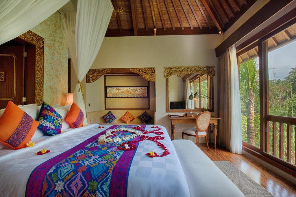 Postel nebo postele na pokoji v ubytování Natya Resort Ubud