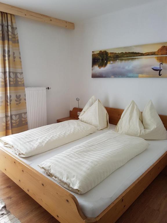 Postel nebo postele na pokoji v ubytování Haus Straif
