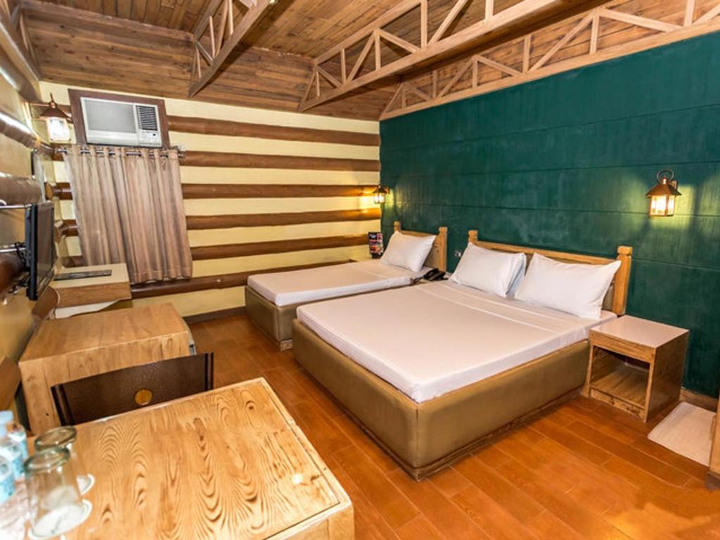 Postel nebo postele na pokoji v ubytování Urban Travellers Hotel