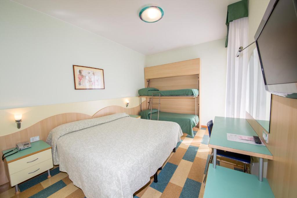Postel nebo postele na pokoji v ubytování Hotel Nember