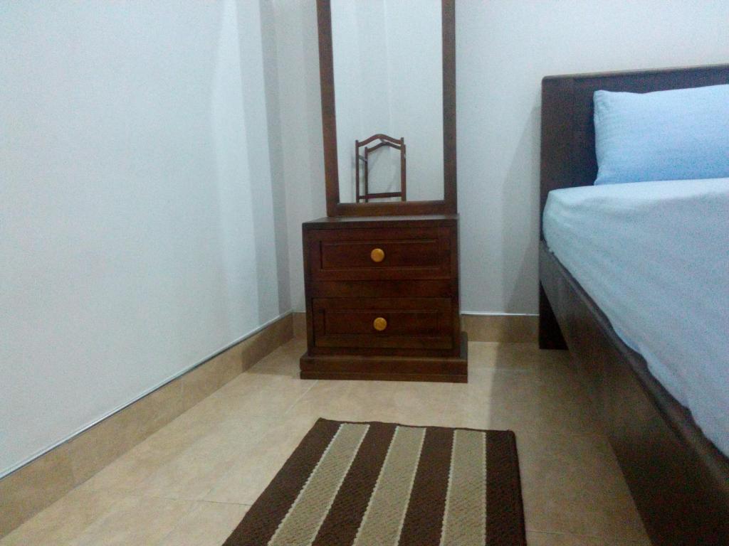 Postel nebo postele na pokoji v ubytování Diyawara Home Stay