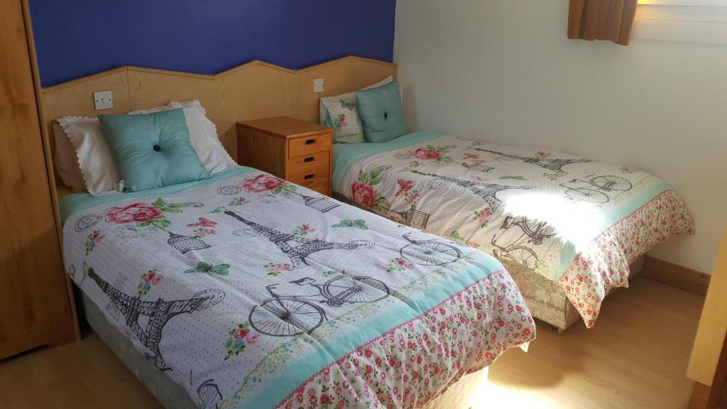 Postel nebo postele na pokoji v ubytování Divine Mercy B&B