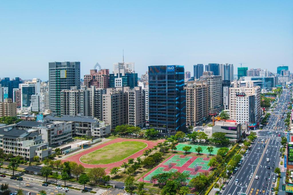 an aerial view of a city with a freeway at H2O HOTEL in Kaohsiung