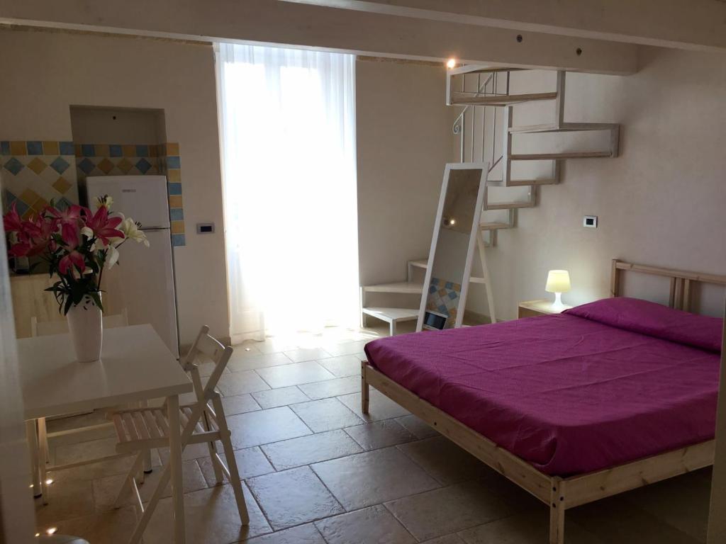 Postel nebo postele na pokoji v ubytování Cantaluna B&B