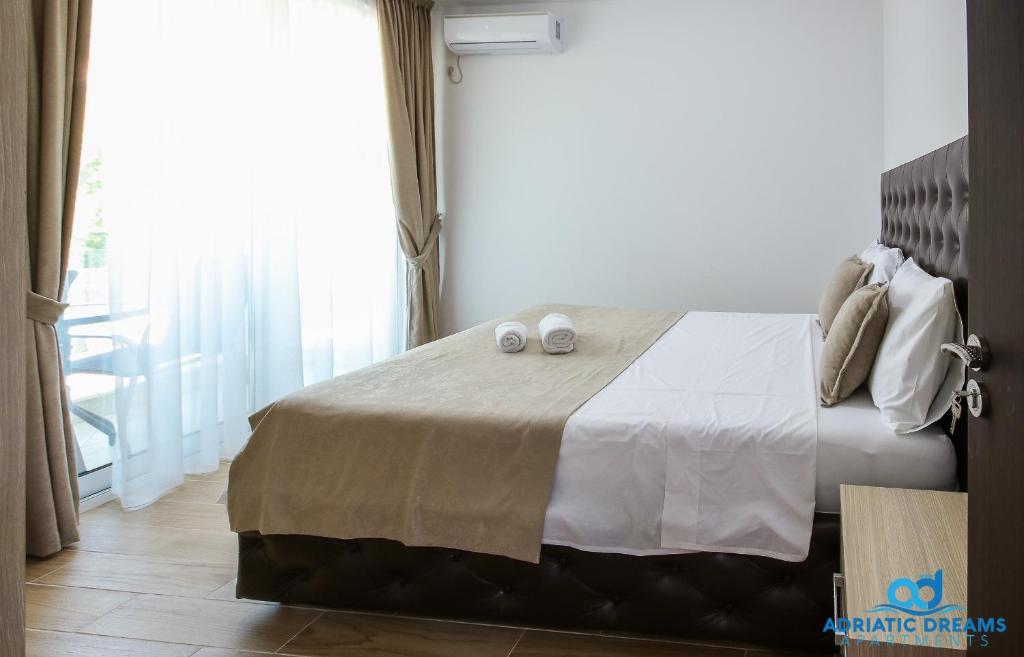 Postel nebo postele na pokoji v ubytování Adriatic Dreams Apartments