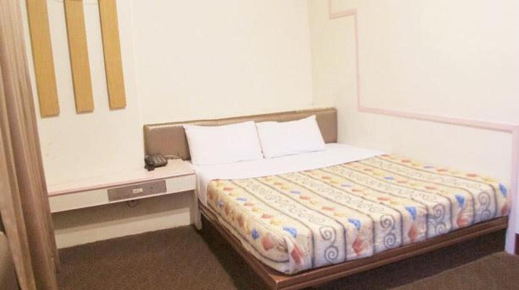 Postel nebo postele na pokoji v ubytování Teresa Hotel