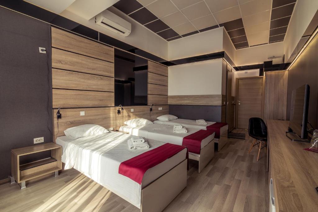 Postel nebo postele na pokoji v ubytování Hotel De KOKA