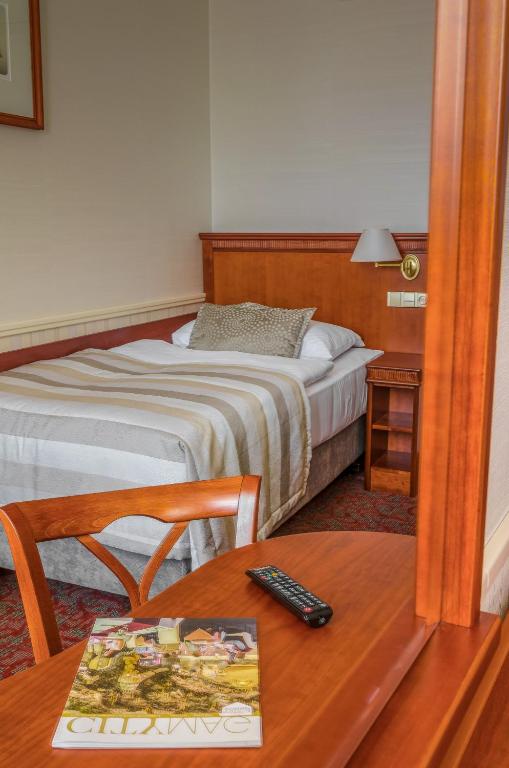 Postel nebo postele na pokoji v ubytování Adria Hotel Prague