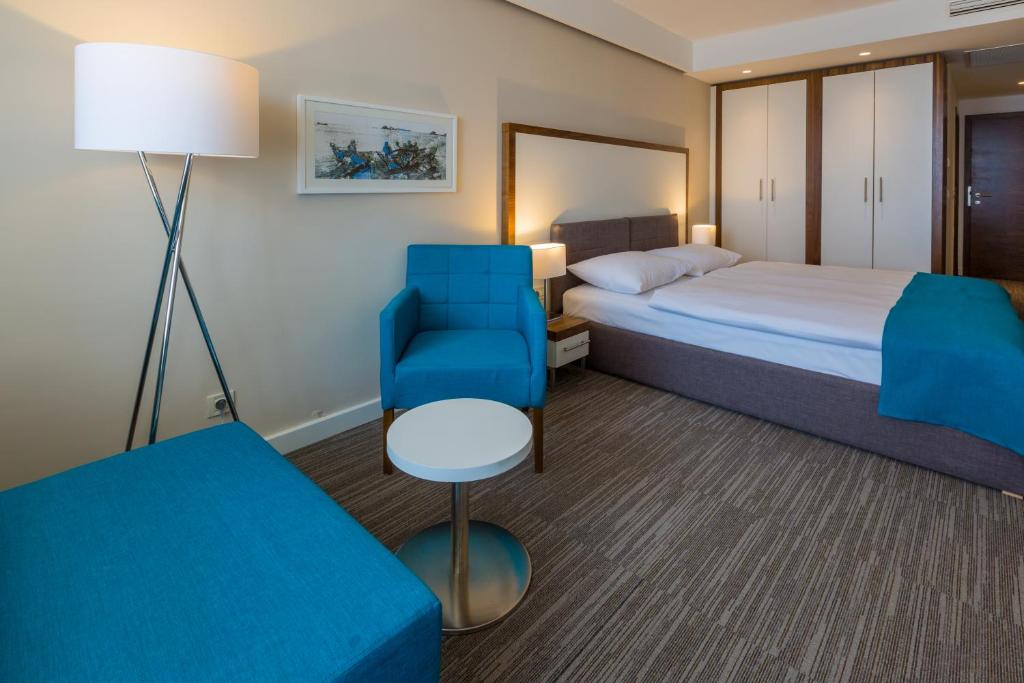 Een bed of bedden in een kamer bij Hotel Katarina