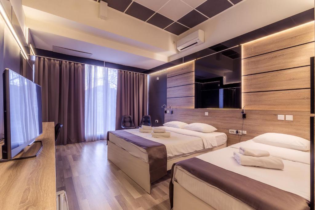 Postel nebo postele na pokoji v ubytování Hotel De KOKA