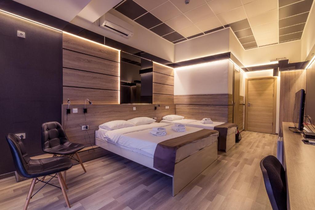 Postel nebo postele na pokoji v ubytování Hotel De KOKA