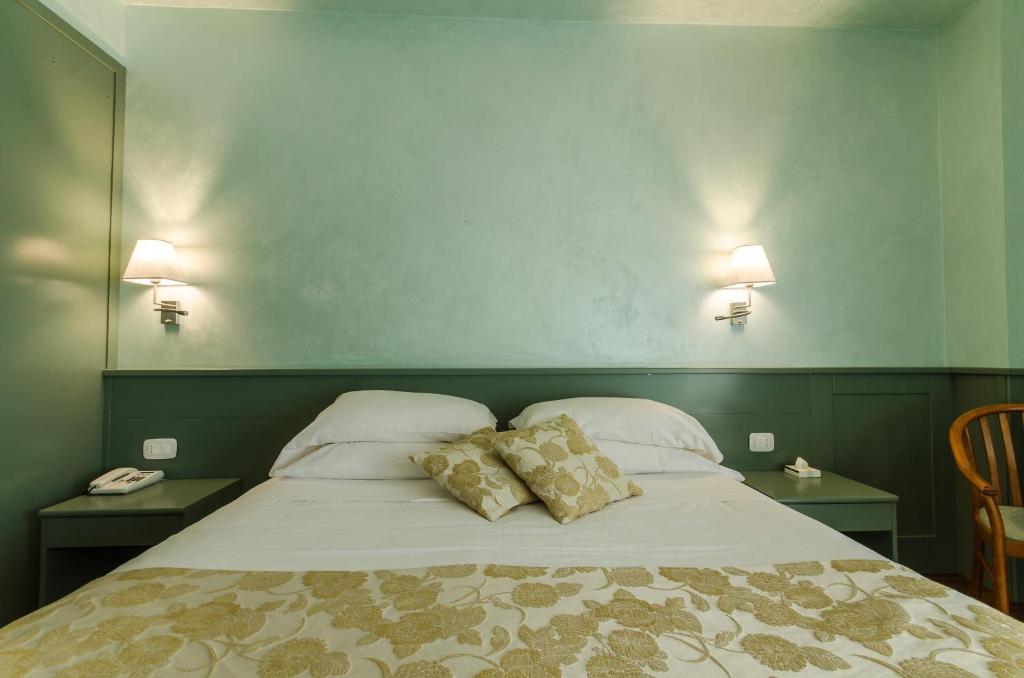 Postel nebo postele na pokoji v ubytování Hotel Santacroce Meeting
