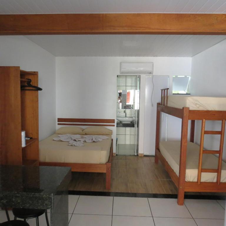 Postel nebo postele na pokoji v ubytování Recanto da Ilha