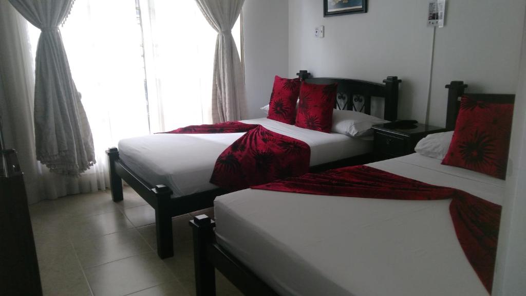 Postel nebo postele na pokoji v ubytování Hotel Colonial