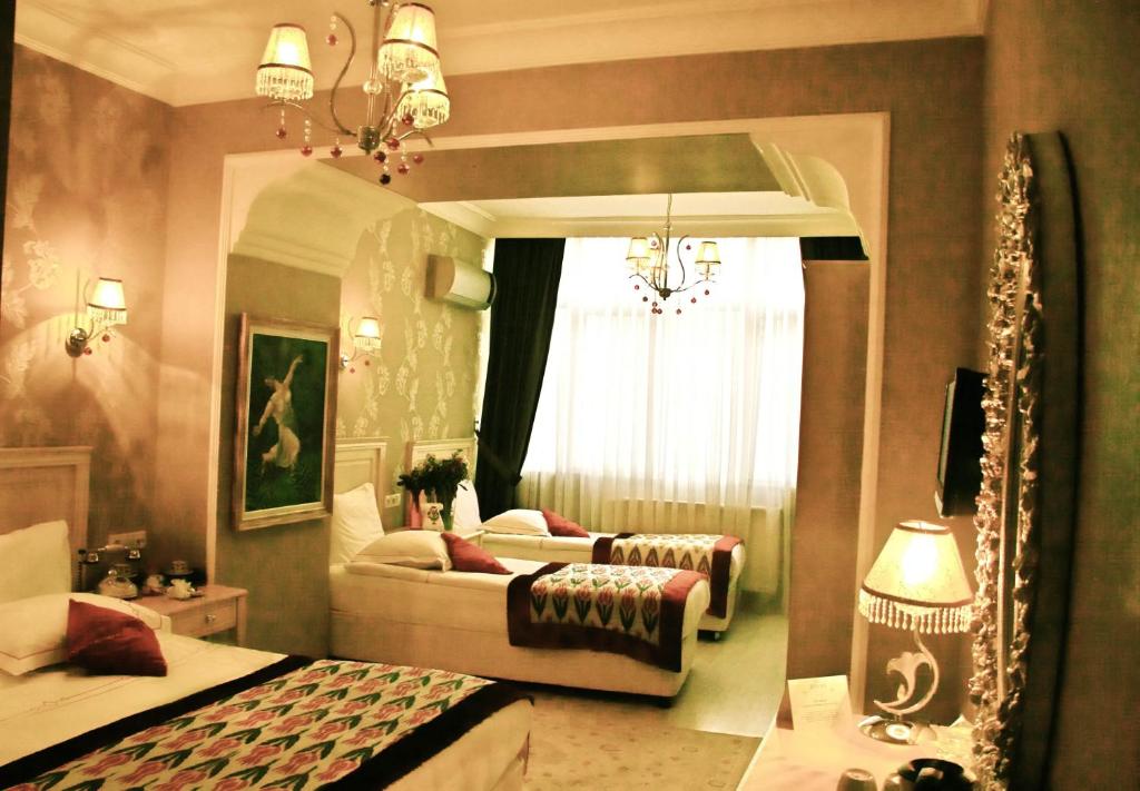 Postel nebo postele na pokoji v ubytování Divas Hotel