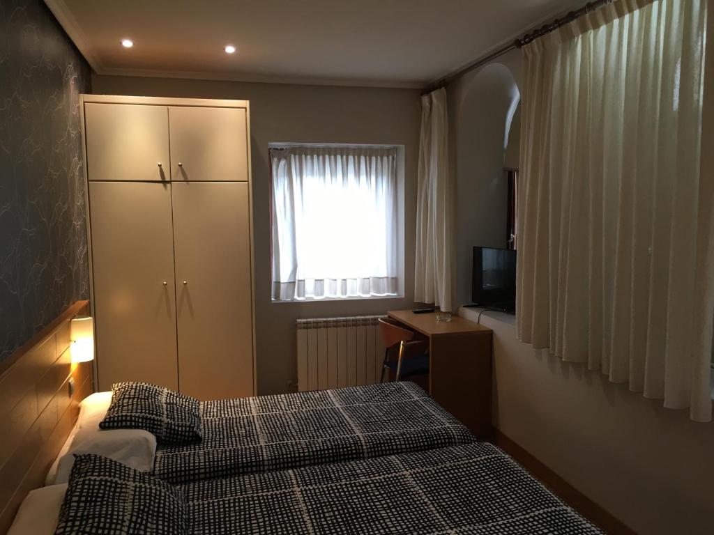 Postel nebo postele na pokoji v ubytování Hotel Errekagain