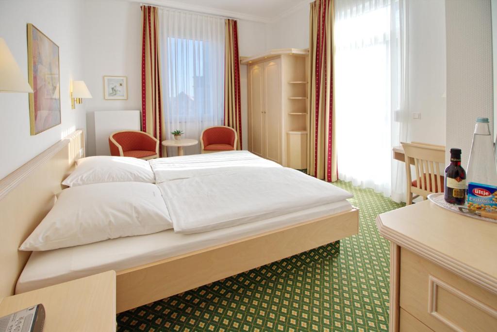 Postel nebo postele na pokoji v ubytování Hotel Westfalenhof