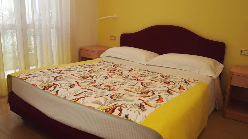 Postel nebo postele na pokoji v ubytování Piccolo Hotel