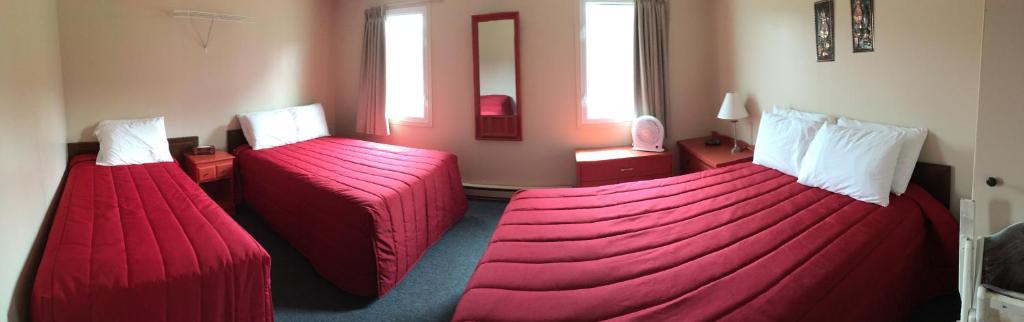 Postel nebo postele na pokoji v ubytování Motel Sainte-Flavie