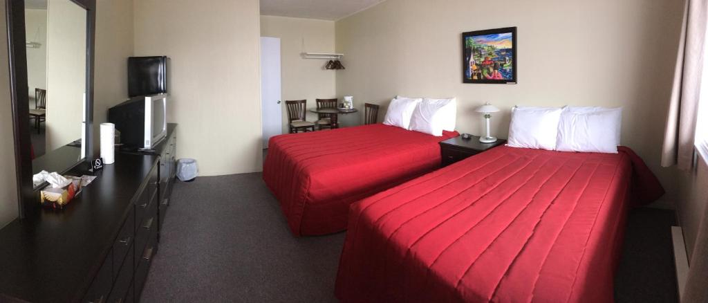 Postel nebo postele na pokoji v ubytování Motel Sainte-Flavie
