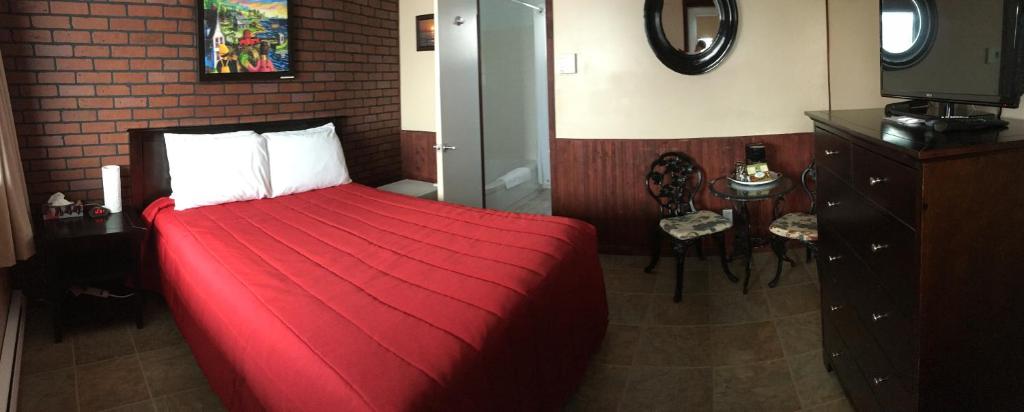 Postel nebo postele na pokoji v ubytování Motel Sainte-Flavie