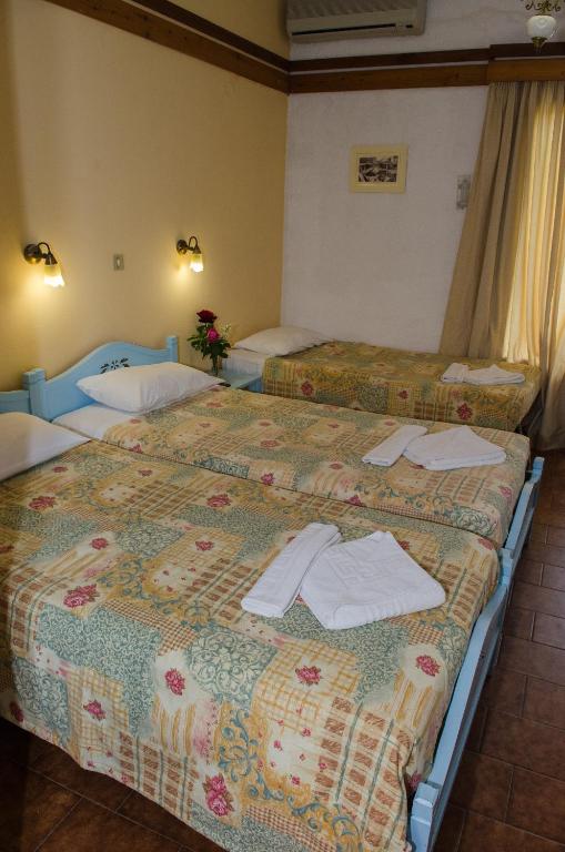 Postel nebo postele na pokoji v ubytování Alkion Hotel