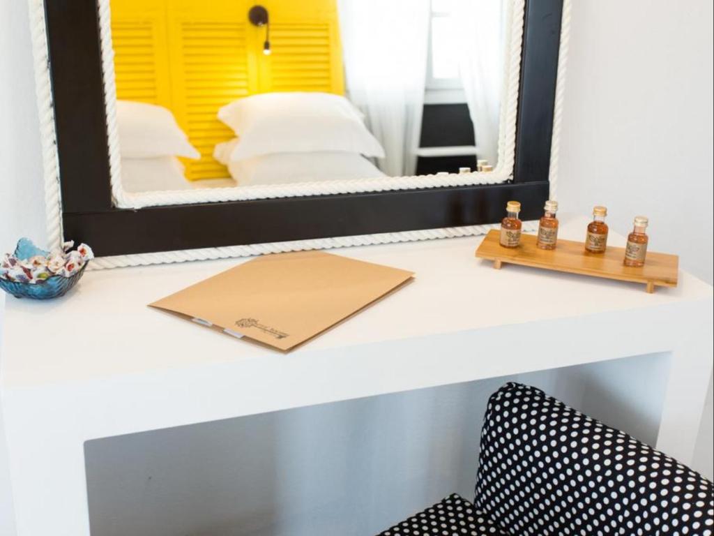 Postel nebo postele na pokoji v ubytování Evi Rooms