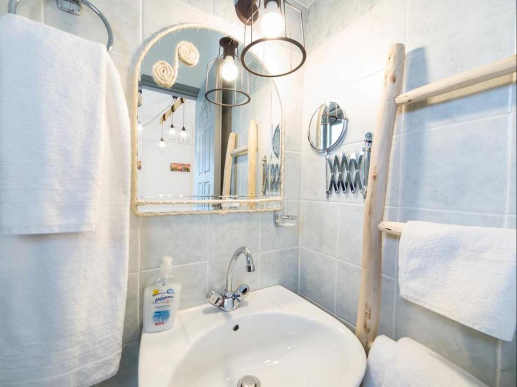 Koupelna v ubytování Evi Rooms