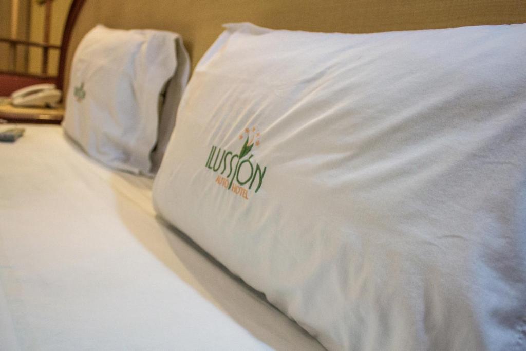 Postel nebo postele na pokoji v ubytování Autohotel Ilussion