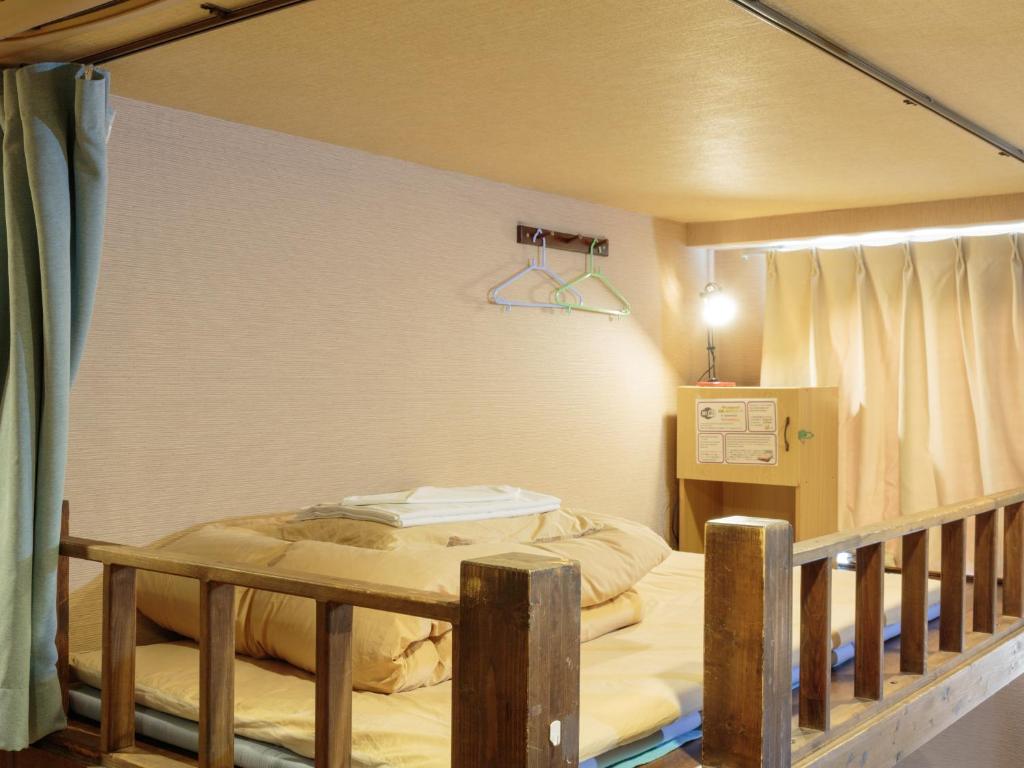 Postel nebo postele na pokoji v ubytování Kyoto Hana Hostel