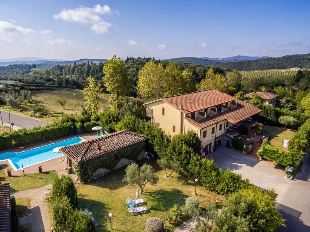 an aerial view of a house with a swimming pool at Le Volpaie in San Gimignano