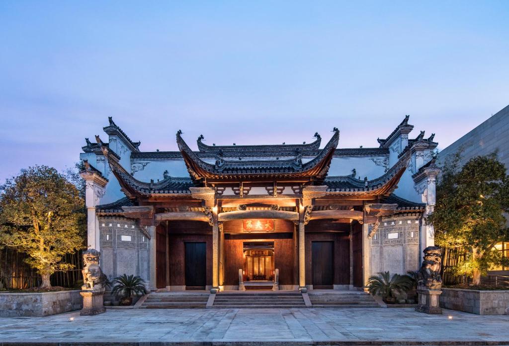 an asian style building with a gate at Ahn Luh Zhujiajiao in Qingpu