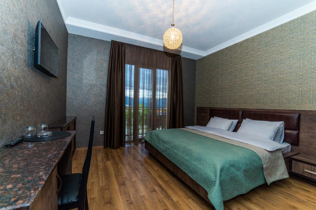 Postel nebo postele na pokoji v ubytování Hotel New Telavi
