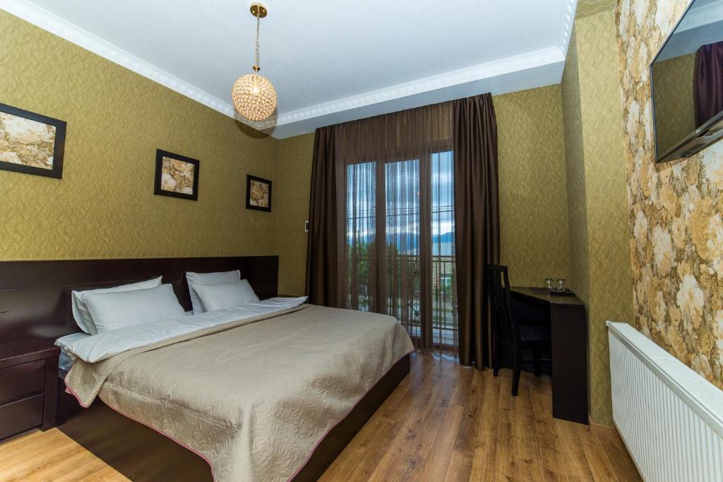 Postel nebo postele na pokoji v ubytování Hotel New Telavi