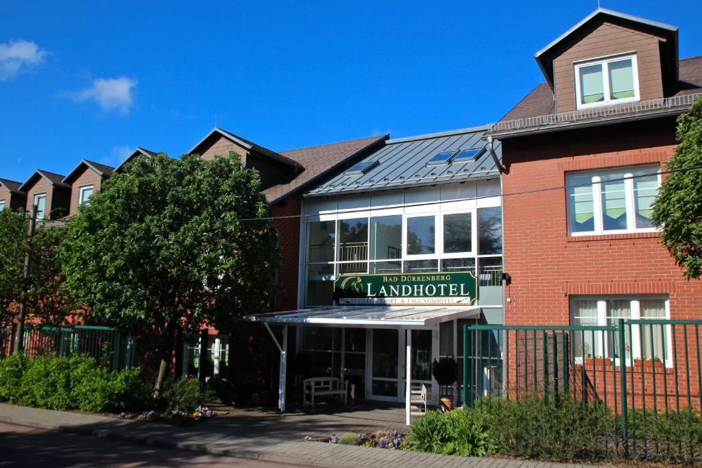 a building with a sign that reads lairdlords at Landhotel Bad Dürrenberg in Bad Dürrenberg