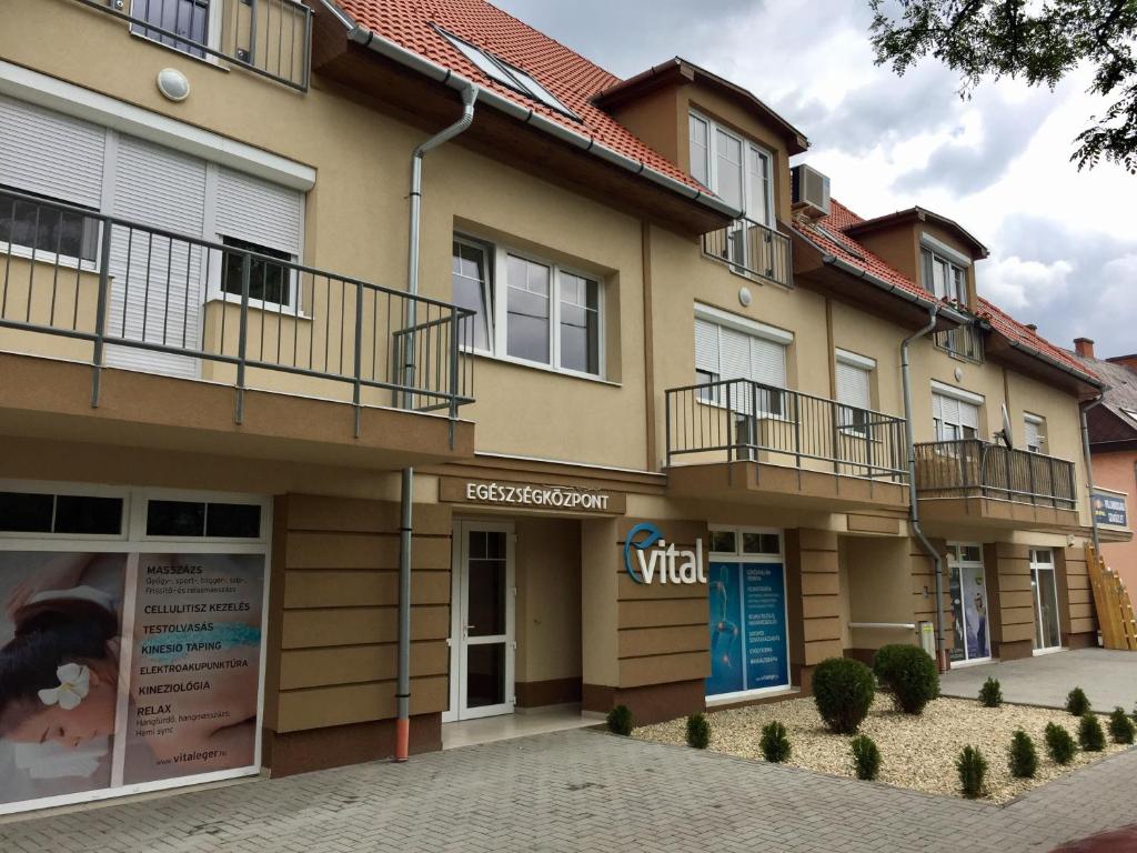 a building with balconies on the side of it at BarAnd Apartman in Eger