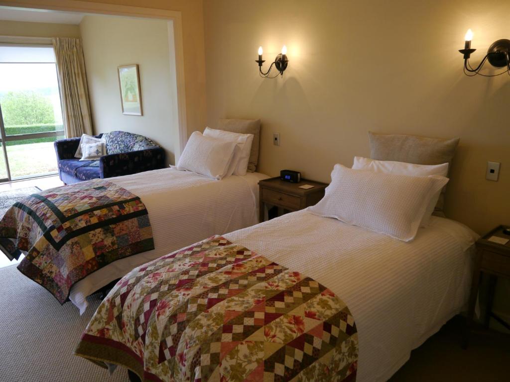 Postel nebo postele na pokoji v ubytování Country Lodge Kinloch