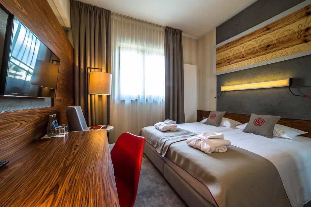 Posteľ alebo postele v izbe v ubytovaní Hotel Kopieniec Fizjo- Med & SPA