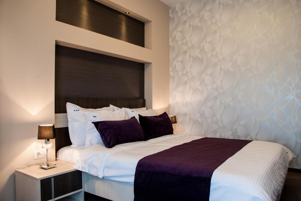 Postel nebo postele na pokoji v ubytování Milano Blue Mamaia