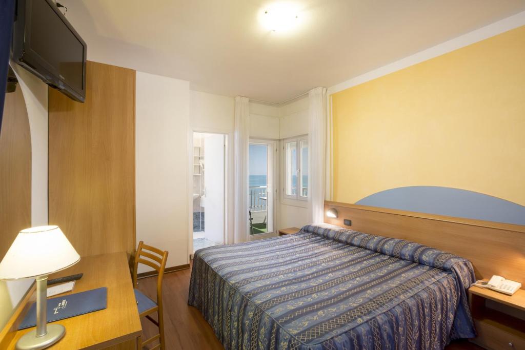 Postel nebo postele na pokoji v ubytování Hotel Adria sul Mare