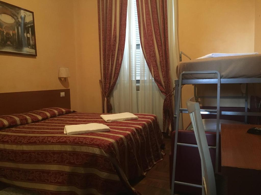 Postel nebo postele na pokoji v ubytování Toffa Place In Rome