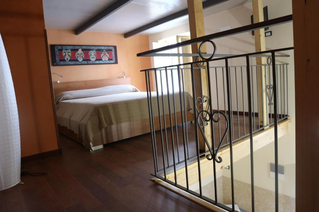 Ένα ή περισσότερα κρεβάτια σε δωμάτιο στο Casa degli Agrumi al Centro