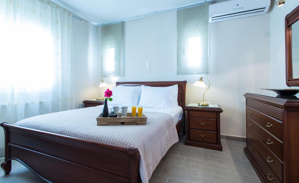 Łóżko lub łóżka w pokoju w obiekcie Diamante Beachfront Suites
